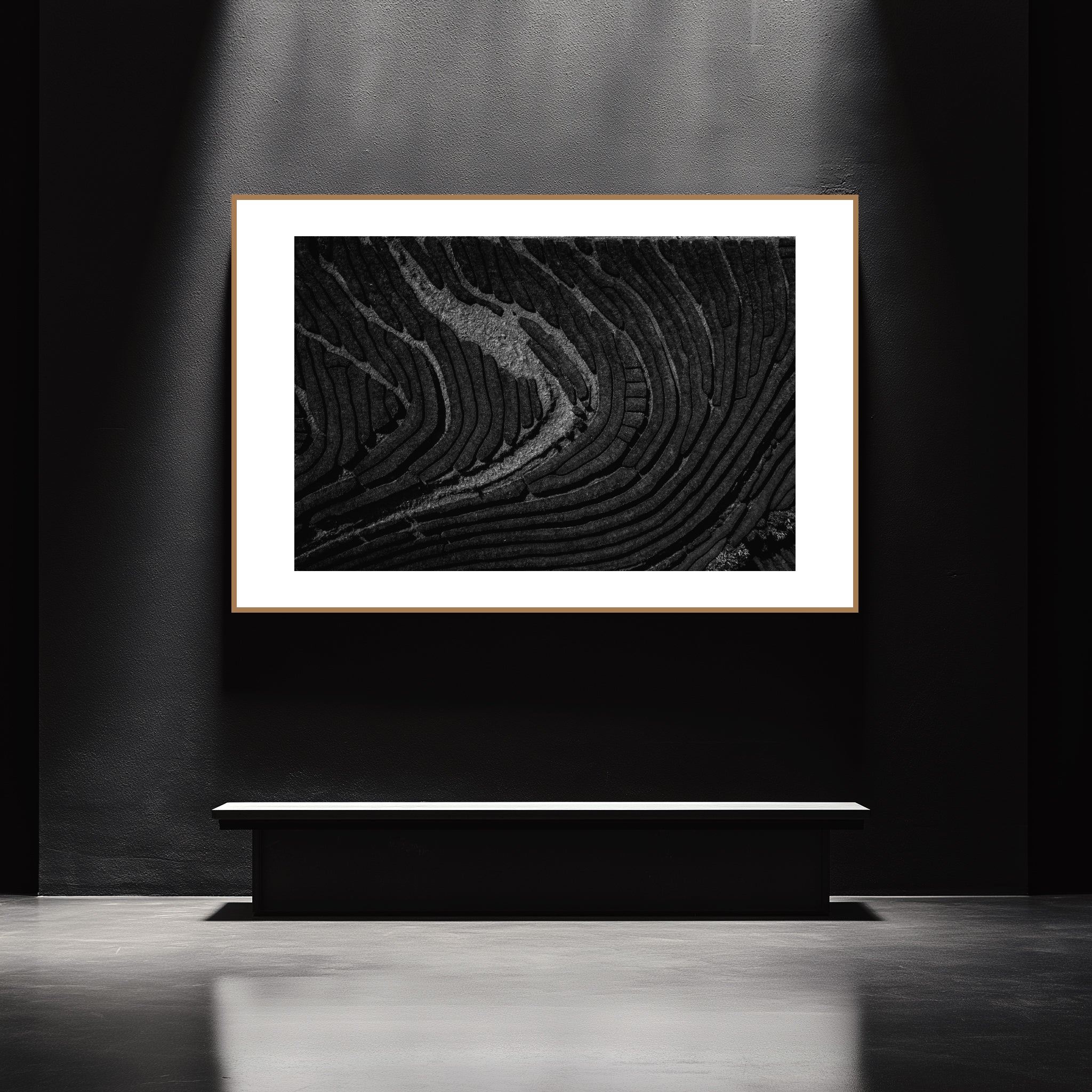 Mockup of a Black and white photo of undulating lines across a tea plantation, capturing the texture and harmony of the landscape, with light and shadow reflecting the tradition of cultivation.